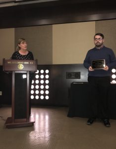 Ethan Anderson receiving award
