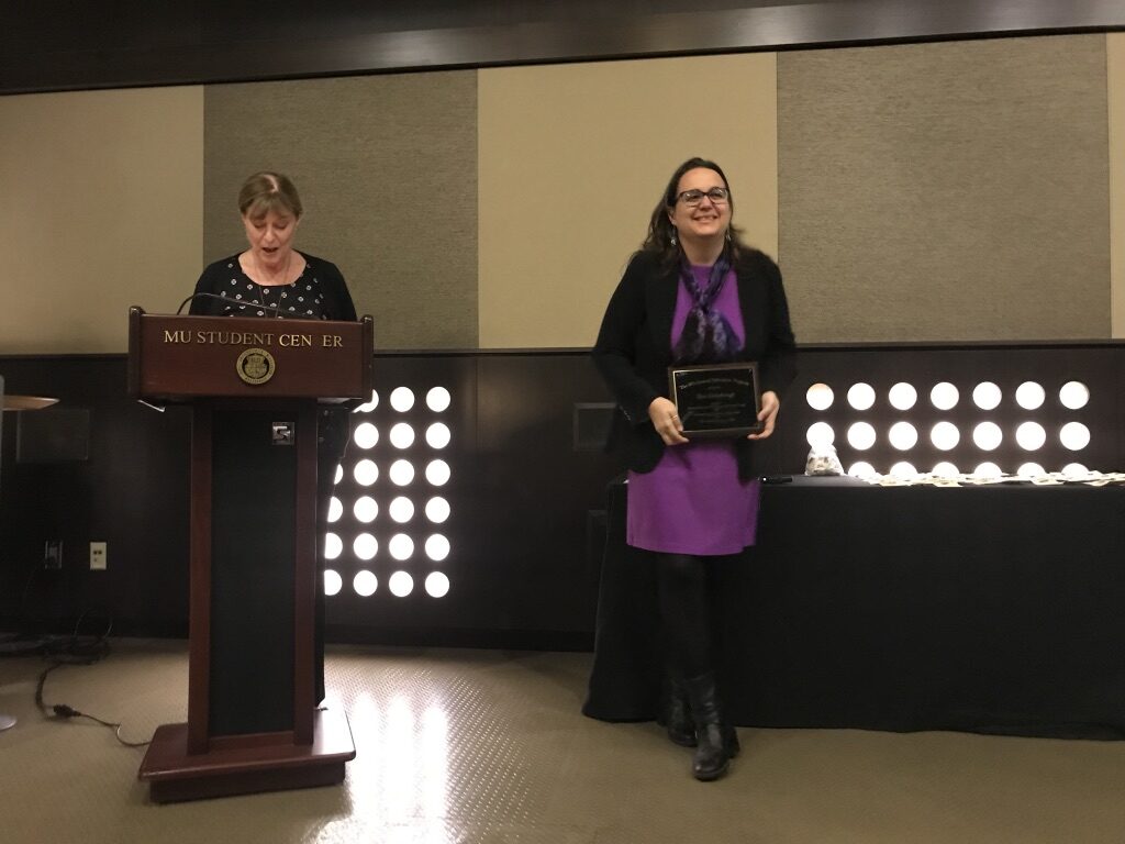 Tessi Rickabaugh receiving award
